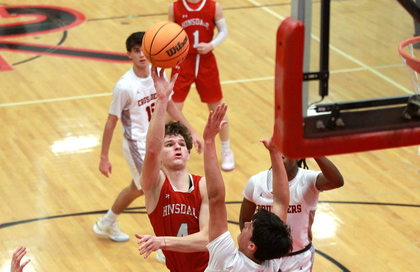 Hinsdale Central’s Vincas Buzelis get a shot up during the Hinsdale Holiday Classic championship game against Brother Rice on Monday, Dec. 30, 2024 in Hinsdale.