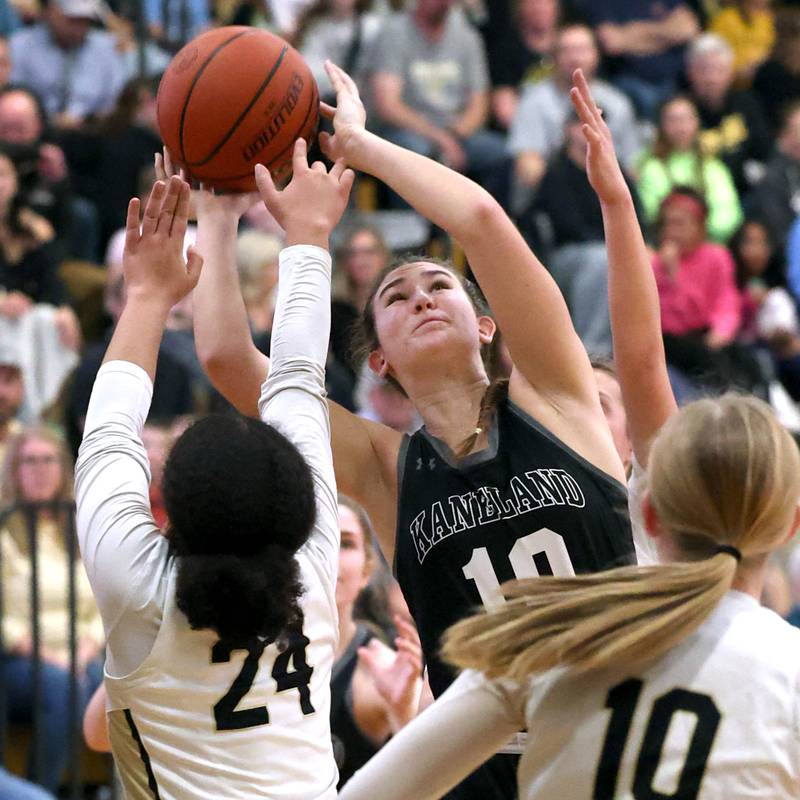 Kaneland's Emily Kunzer shoots over Sycamore's Monroe McGhee during their Class 3A sectional semifinal Tuesday, Feb. 20, 2024, at Sycamore High School.