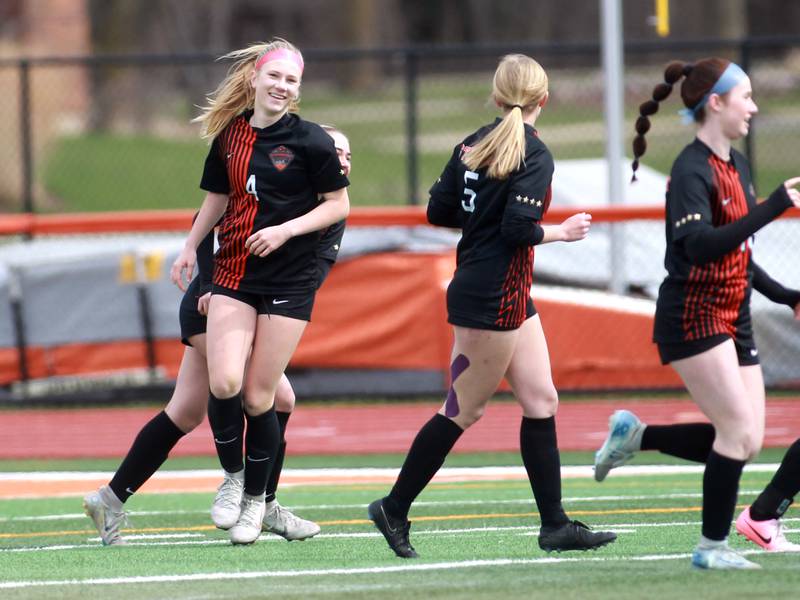 St. Charles East player Presley Kannaka (left) celebrates with her team after her goal during a game on Tuesday, April 1, 2025 against Burlington Central in St. Charles.