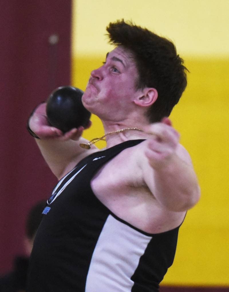 St. Charles North’s Paolo Gennarelli throws the shot put during the DuKane boys indoor track meet at Batavia High School Saturday.