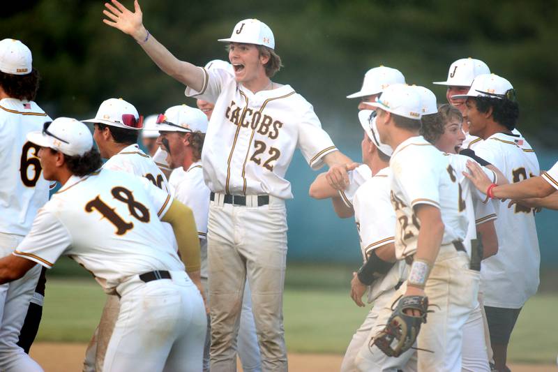 Jacobs’ Gavin Feck and the Golden Eagles celebrate a win over Huntley in Class 4A Sectional baseball action at Carpentersville Wednesday.