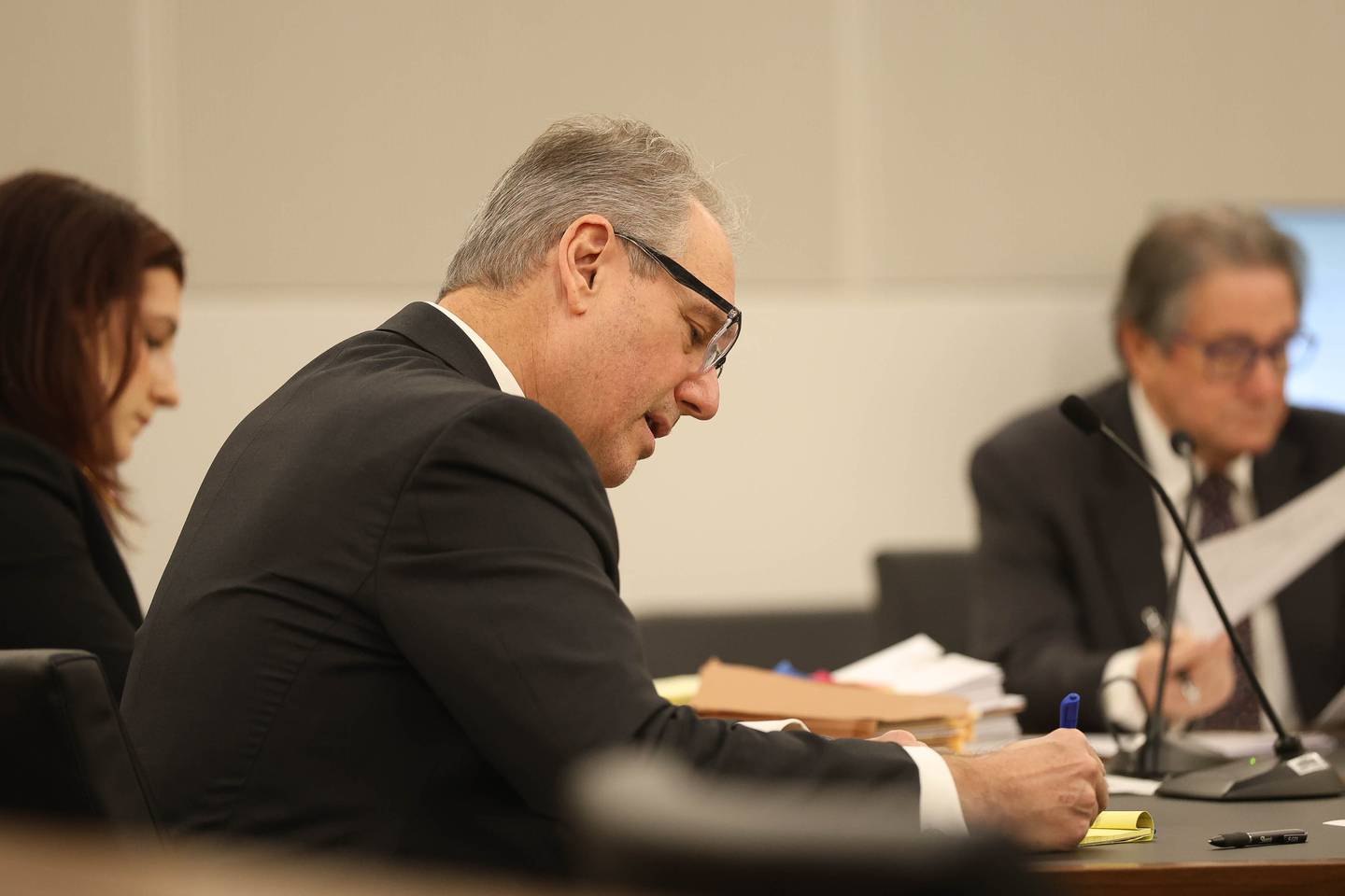 Joliet City Council member Juan Moreno’s attorney Frank Andreano takes notes during a hearing Monday on the case challenging Joliet City Council member Juan Moreno's legitimacy to hold office. Monday, Dec. 8, 2025 at the Will County Courthouse in Joliet.