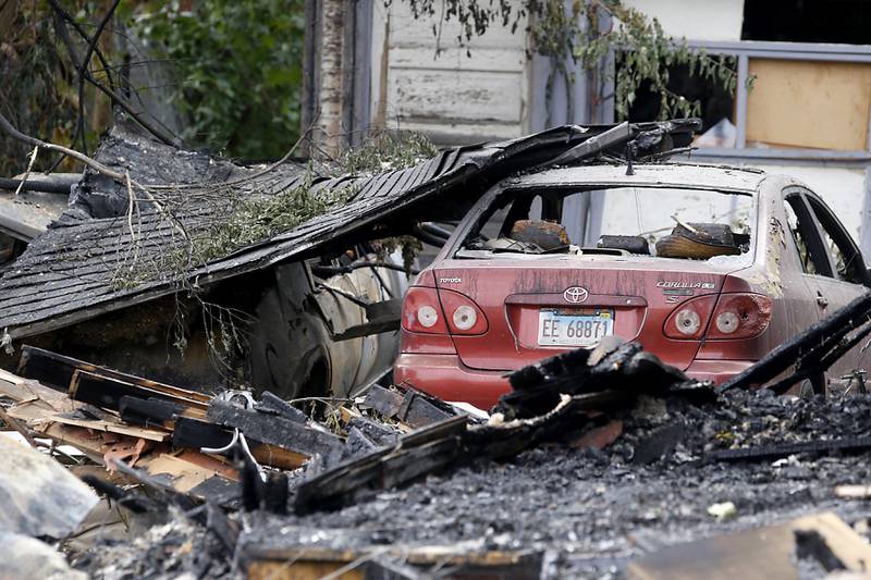 Damaged cars in the 300 block of Lincoln Avenue on Tuesday, October 10, 2023, after an explosion following a gas leak in the area leveled one home as caused several fires.