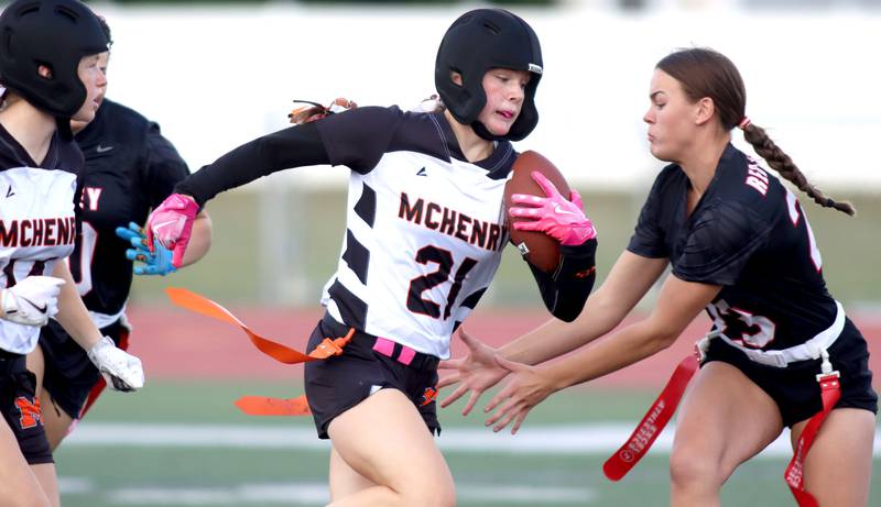 McHenry’s Lyla Oeffling carries the ball in varsity flag football at Huntley High School in Huntley on Tuesday, Sept. 9, 2025.