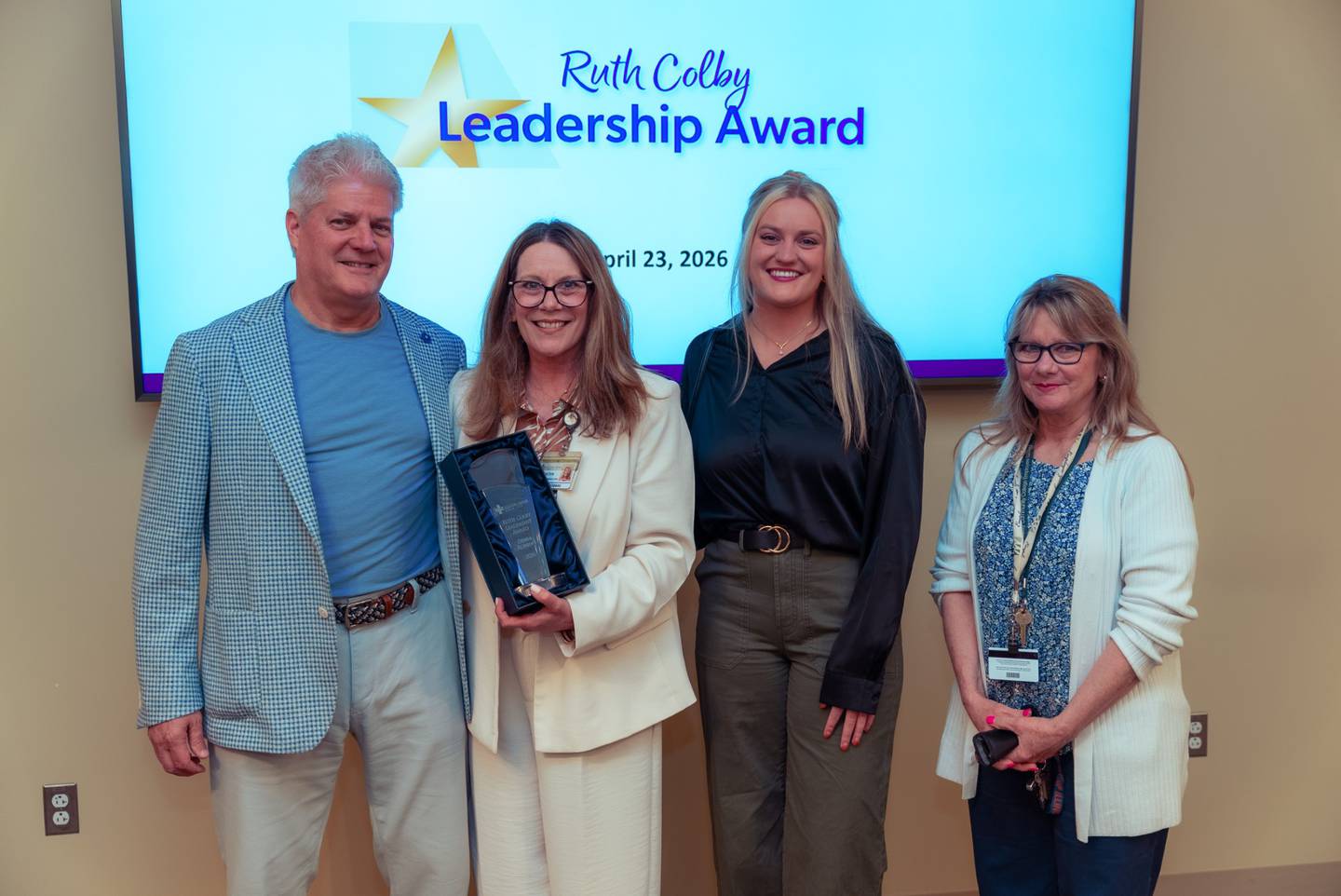 Debra Robbins, director of marketing & communications at Silver Cross Hospital in New Lenox, received the Ruth Colby Leadership Award on Thursday, April 23, 2026, during the hospital’s monthly leadership meeting at the New Lenox hospital. Debra Robbins husband Michael Robbins, daughter Kelly Robbins, and sister Tammy Williams were also present at the awards celebration.