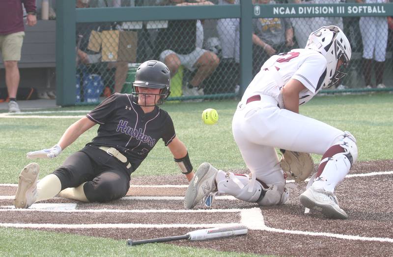 Serena's Jenna Setchell scores the teams first run as the ball gets away from LeRoy catcher Laila Carr during the Class 1A Supersectional game on Monday, June 2, 2025 at Illinois Wesleyan Univesity in Bloomington.