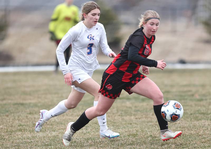 Indian Creek's Jolee Larson tries to out race Genoa-Kingston's Sophia Zaccard for the ball during their game Thursday, March 16, 2023, at Pack Park Sports Complex in Waterman.
