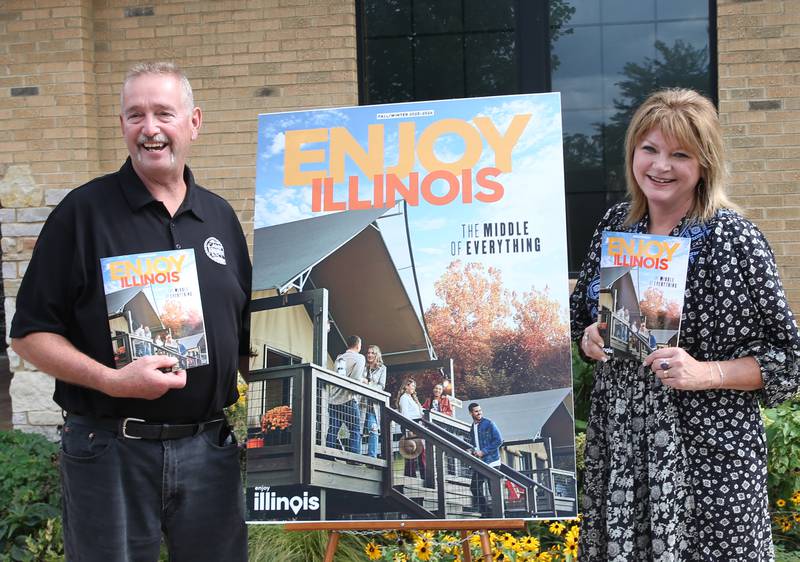 Tim and Jennifer Bias, owners of Camp Aramoni are presented with the cover of the fall winter 2023-2024 Enjoy Illinois magazine on Monday, Sept. 18, 2023 at Camp Aramoni.