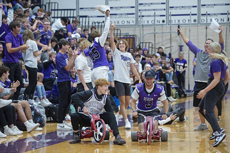The junior class celebrates its big wheel race victory on Friday during Dixon High School's homecoming pep rally.
