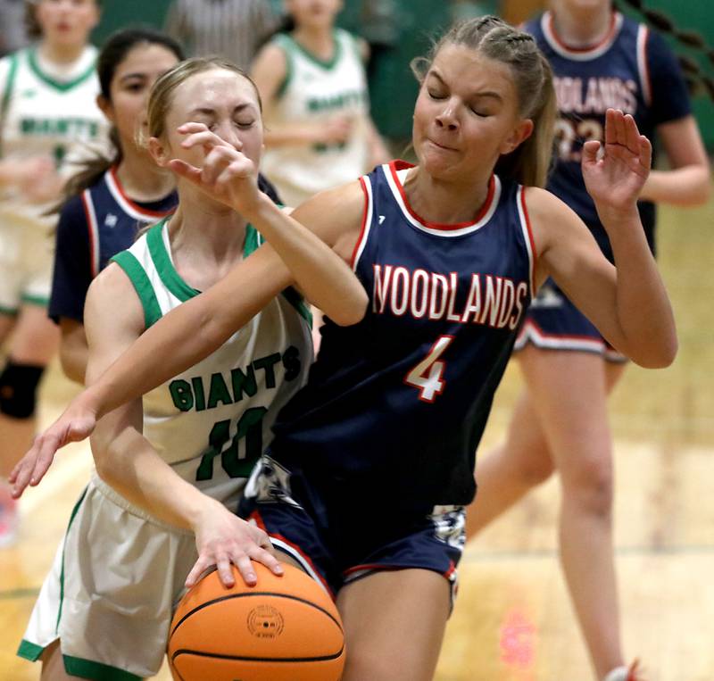 Alden-Hebron's Olivia Klein is founded by Woodlands Academy's Emma O'Brien as she drives to the basket during a nononference girls basketball game on Thursday, Jan. 29, 2026, at Alden-Hebron High School in Hebron.
