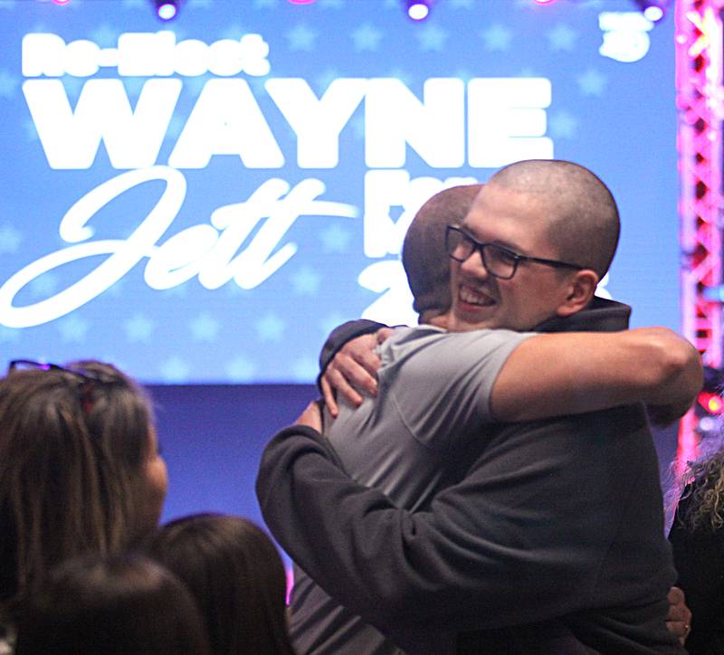 McHenry mayoral candidate and incumbent Wayne Jett hosted an election night party at The Vixen in McHenry on Tuesday, April 1, 2025. Dakota Ruiz of McHenry embraces Jett.