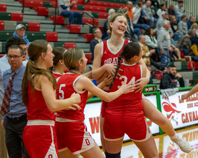 Ottawa's Libby Muffler (25) celebrates with team after Regional Championship Win over Sterling on Thursday, Feb. 19, 2026 in Sellett Gymnasium at L-P High School.