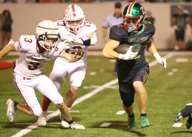 L-P's Landon Zellers runs with the ball as Ottawa defenders George Shumway and Ethan Poutre defend on Friday, Oct. 3, 2025 at Howard Fellows Stadium.