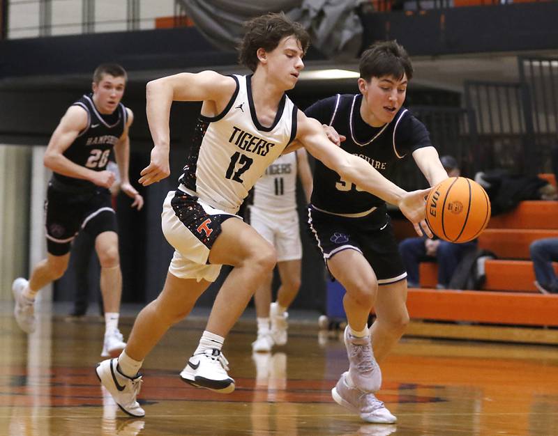 Crystal Lake Central's Michael Shanahan battles with Hampshire's Sean Roth as they chase down a loose ball during a Fox Valley Conference basketball game on Friday, Feb. 7, 2025, at Crystal Lake Central High School.