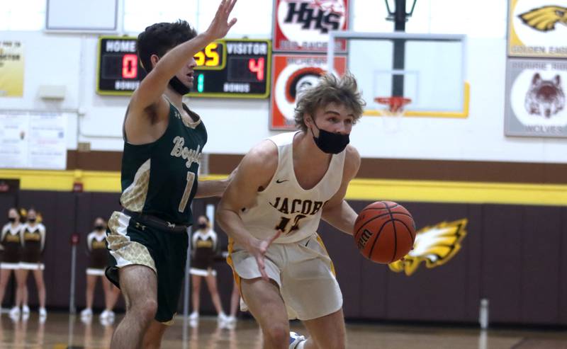 Jacobs’ Jackson Martucci moves with the ball during boys varsity basketball against Rockford Boylan at Algonquin Saturday afternoon.