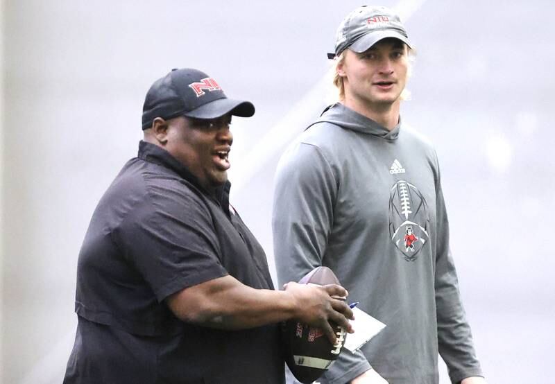 Northern Illinois quarterback Rocky Lombardi (right) talks to head coach Thomas Hammock during the teams first spring practice Wednesday, March 22, 2023, in the Chessick Practice Center at Northern Illinois University in DeKalb.