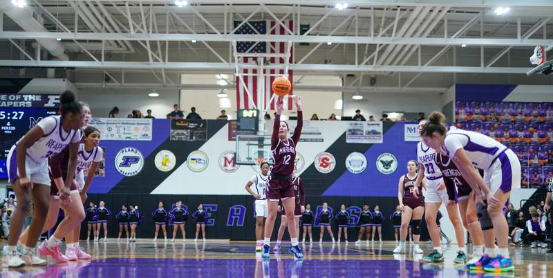 Marengo’s Gabby Gieseke (12) shoots a free throw during a basketball game against Plano at Plano High School on Wednesday, January 29, 2025.
