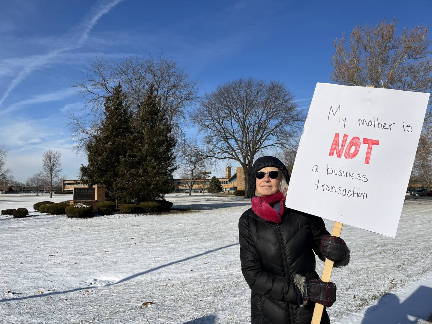 Kate Azo attends a rally held on Monday, Dec. 19, 2022, to keep Our Lady of Angels Retirement Home open. The facility is scheduled for closure on Feb. 28, 2023.