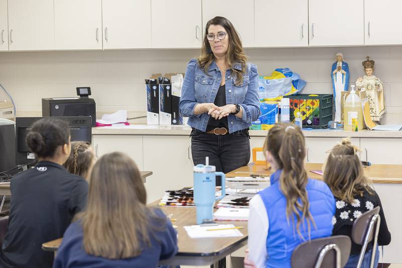 Cosmetologist Sara Graham talks to students at St. Mary’s School in Sterling about why she loves her job Monday, Jan. 29, 2024. The school brought in several professionals to speak to the students in celebration of Catholic Schools Week.