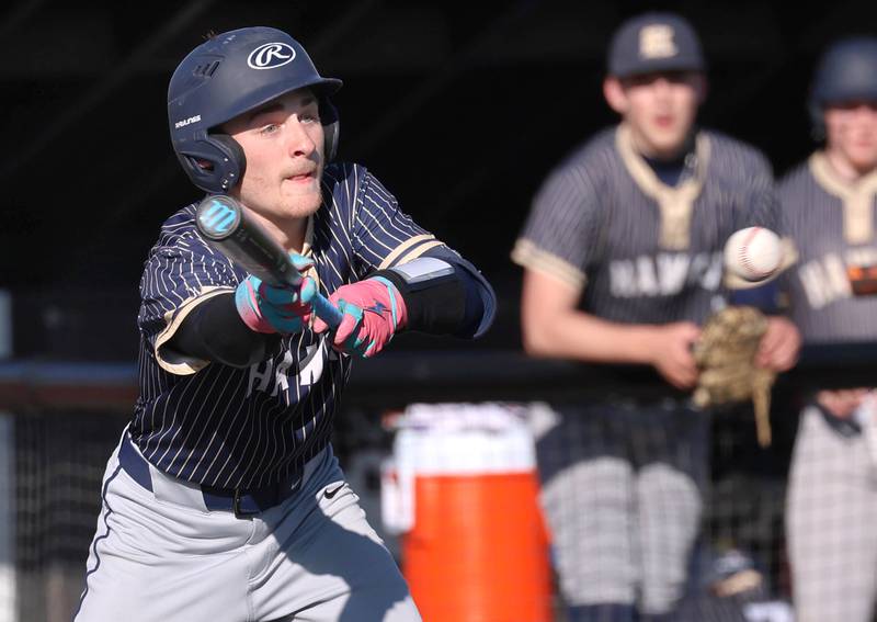 Hiawatha's Hunter Ziegler squares to bunt during their game against South Beloit Thursday, April 16, 2026, at Northern Illinois University in DeKalb.