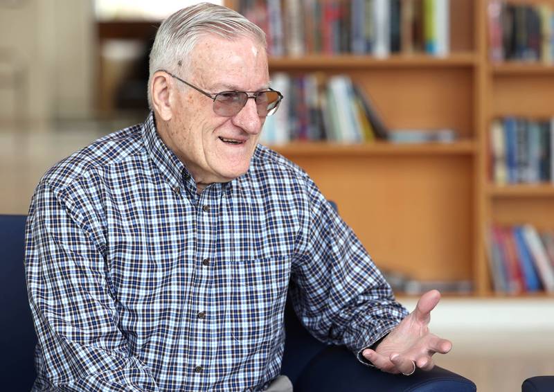Longtime DeKalb Public Library volunteer Paul Mandigo, 83, talks Wednesday, March 25, 2026, at the facility about why he enjoys helping out at the library.