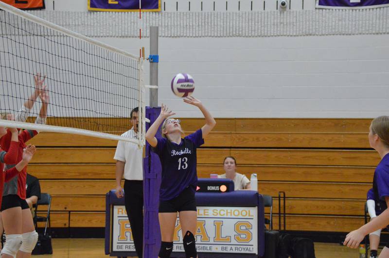 Rochelle's Madelynn McRoberts sets the ball during a seventh-grade volleyball match with Prairie Knolls.