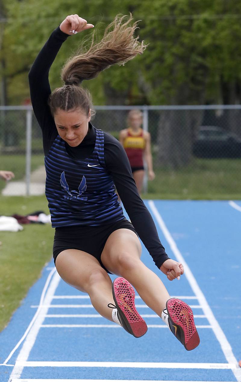 Woodstock’s Mia Foss competes in the long jump during the Kishwaukee River Conference Girls Track and Field Meet on Tuesday, May 5, 2025, at Woodstock High School.