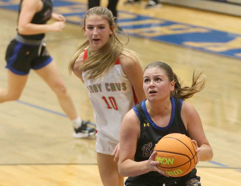 Somonauk's Kiley Mason eyes the hoop after dribbling around L-P's Kelsey Frederick during the Tim Humes Breakout Tournament on Friday, Nov. 22, 2024 at Somonauk High school.