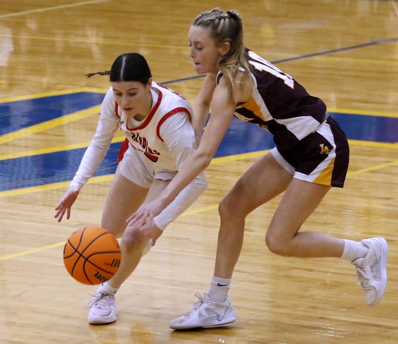 Huntley's Aubrina Adamik tries to bring the ball up the court against Loyola Academy's Clare Weasler during the IHSA Class 4A Gurnee Warren Supersectional girls basketball game on Monday, March 3, 2025, at Warren Township High School in Gurnee.