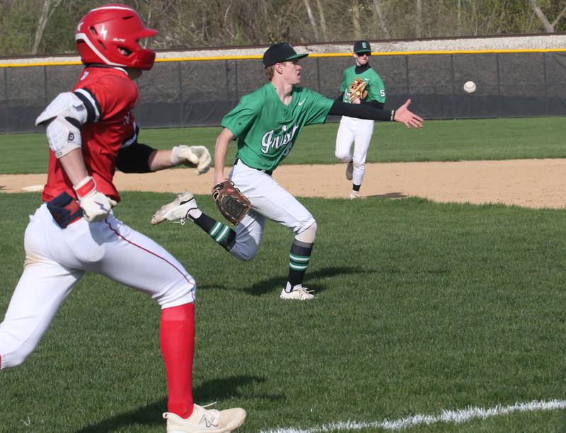 Seneca pitcher Paxton Giertz tosses the ball to first base to force out Streator's Zander McCloskey on Friday, April 19, 2024 at Seneca High School.