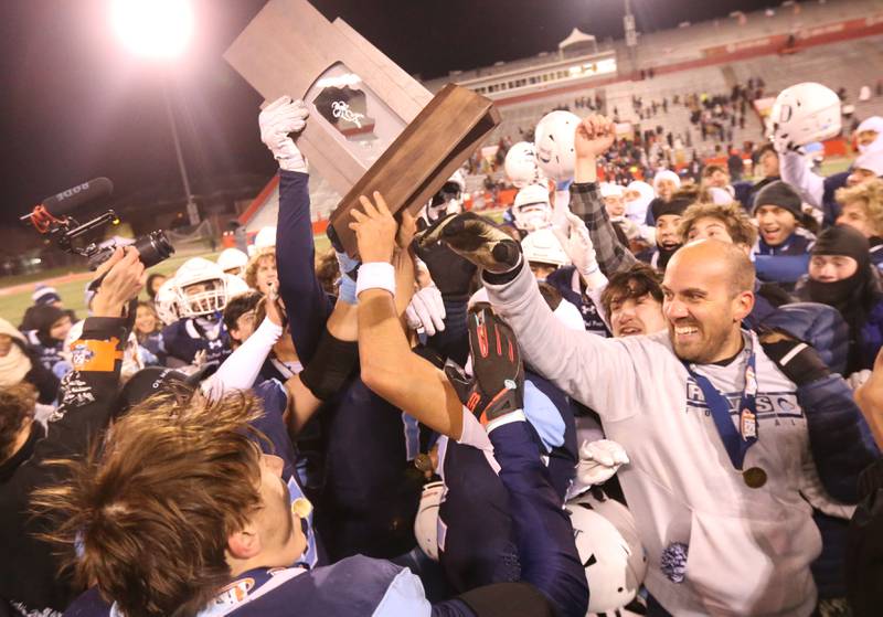 DePaul head coach Mike Passarella celebrates with his team after winning the Class 4A State football championship on Friday, Nov. 29, 2024 at Hancock Stadium in Normal.