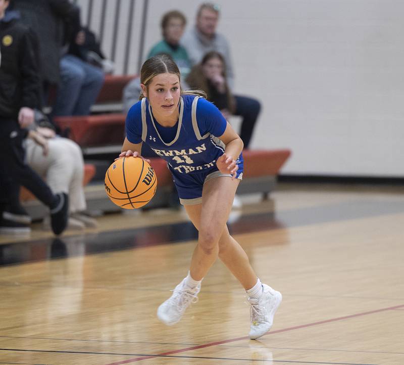 Newman’s Brooklyn Smith brings the ball up court against River Ridge Thursday, Feb. 20, 2025, during the Class 1A girls basketball regional at Forreston.