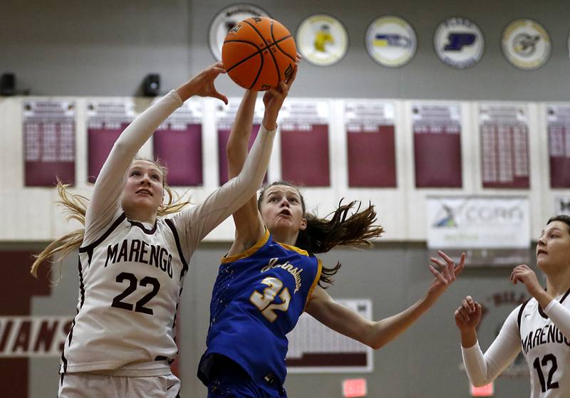 Marengo's Dayna Carr battles with Johnsburg's Skye Toussaint for a rebound during a Kishwaukee River Conference basketball game on Saturday, Feb. 1, 2025, at Marengo High School.