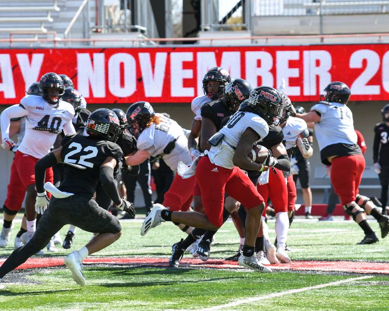 Northern Illinois University wide receiver Billy Dozier,center, gains some yards during the spring scrimmage at Huskie Stadium held on Saturday April 16th.