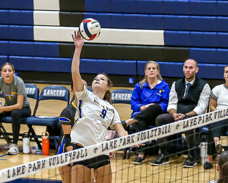 Wheaton North's Hannah Van denend (9) spikes the ball during Class 4A Lake Park Regional final volleyball match between Wheaton North at St Charles North.  Oct 31, 2024  in Roselle.