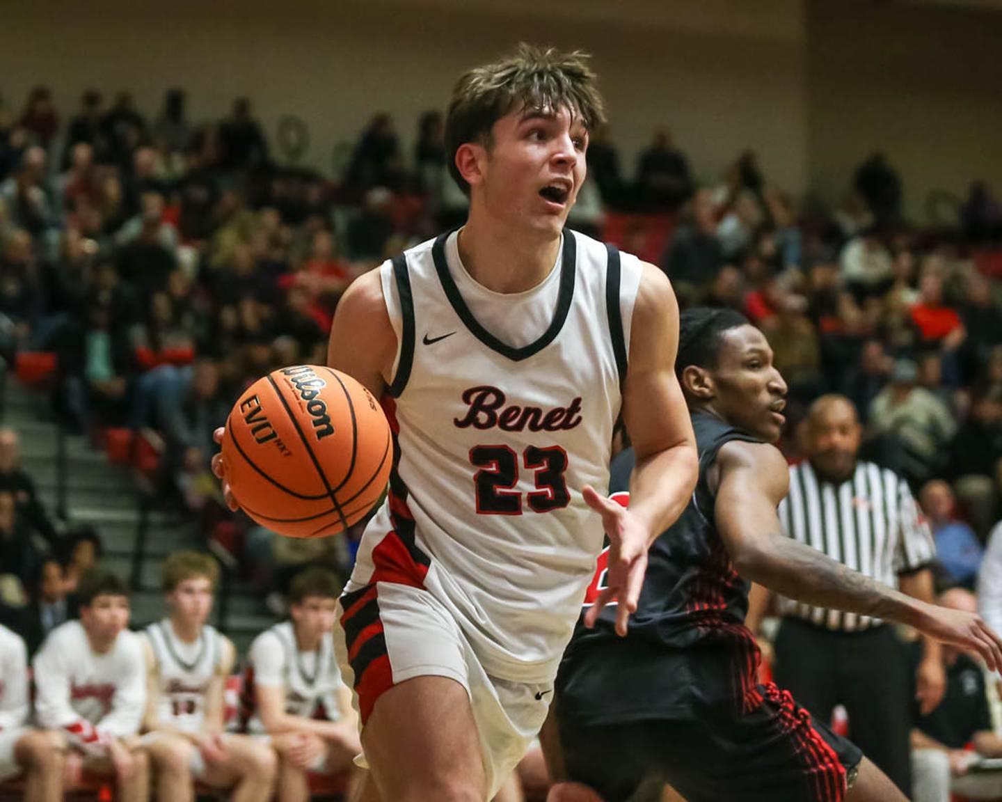 Benet's Edvardas Stasys (23) drives baseline to the basket during their Class 4A Bolingbrook Sectional semifinal basketball game between Yorkville at Benet, March 3, 2026 in Bolingbrook.