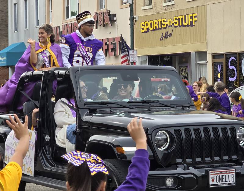 The Mendota Homecoming Queen Ella Martin and King Adan Carbajal wave Friday, Sept. 27, 2024, to the parade crowd.
