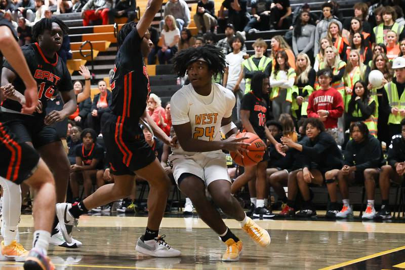 Joliet West’s Micah McNair makes a play along the baseline against Plainfield East on Friday, Dec. 8th, 2023 in Joliet.