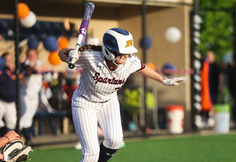 Romeoville’s Analeigh Acosta is hit by a pitch against Joliet Central on Tuesday, April 28, 2026 in Romeoville.