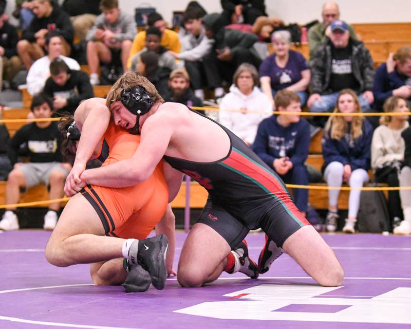 Lasalle-Peru wrestler Connor Lorden, right, tries to keep a hold of a Washington High school Wrestler in the championship match up on Saturday Feb. 11th where Connor took second at the 2A 220 weight class sectional meet held at Rochelle High School.