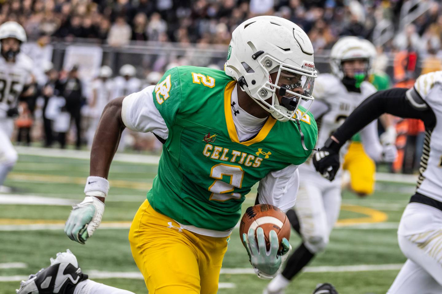 Providence's Xavier Coleman picks-up yardage during a 5A varsity football semifinal game against Oak Forest at Providence Catholic High School on Nov. 22, 2025.