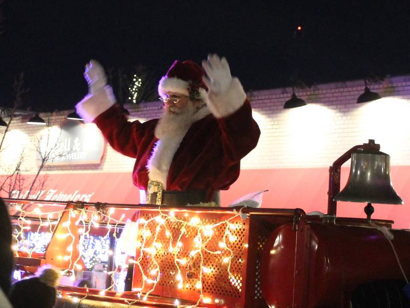 Santa waves to the crowd during the Downtown Crystal Lake Festival of Lights Parade on Nov. 28, 2025.