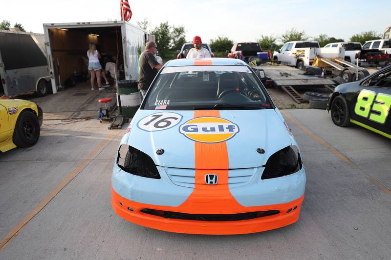 Pure Stock racer Matt Ciara stands at the back off his car before a race on a special fundraising night for the Special Olympics at Grundy County Speedway on June 15, 2024 in Morris.