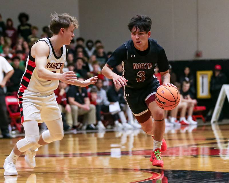 Plainfield North's Lukas Alvarez (3) drives down the lane during their basketball game between Plainfield North at Bolingbrook, Friday Dec 13, 2024 in Bolingbrook.