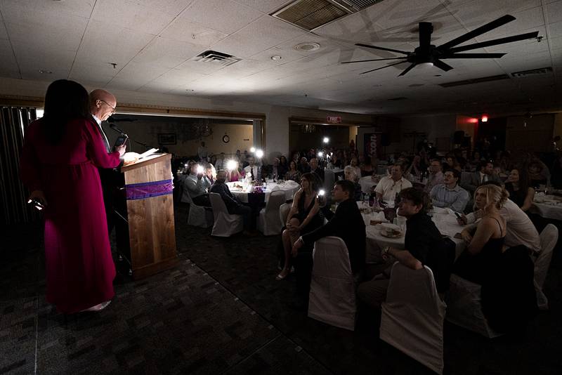 After storms knocked out electricity, Mike Venier continues his recognition for the Lifetime Achievement Award winners, Lorenzo Venier, Joseph Venier, and Louis Venier Friday, April 17, 2026, at the Best of Dixon celebration.