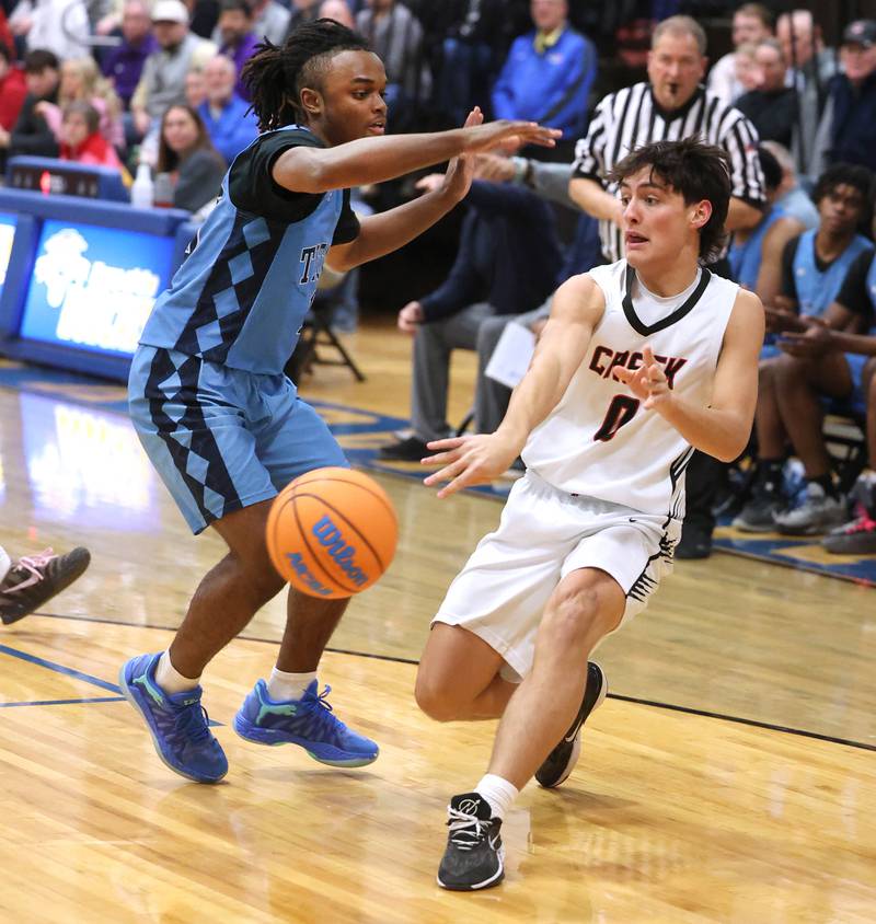 Indian Creek's Cooper Rissman passes the ball around IMSA’s Benjamin Dixson Friday, Feb. 6, 2026, during their Little 10 Conference championship game at Somonauk High School.