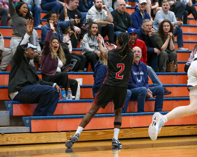 Yorkville's Alonn Flint (2) gestures to his family after hitting a three pointer during their Class 4A Naperville North Regional final basketball game between Yorkville at Downers Grove South, Feb 27, 2026 in Naperville.