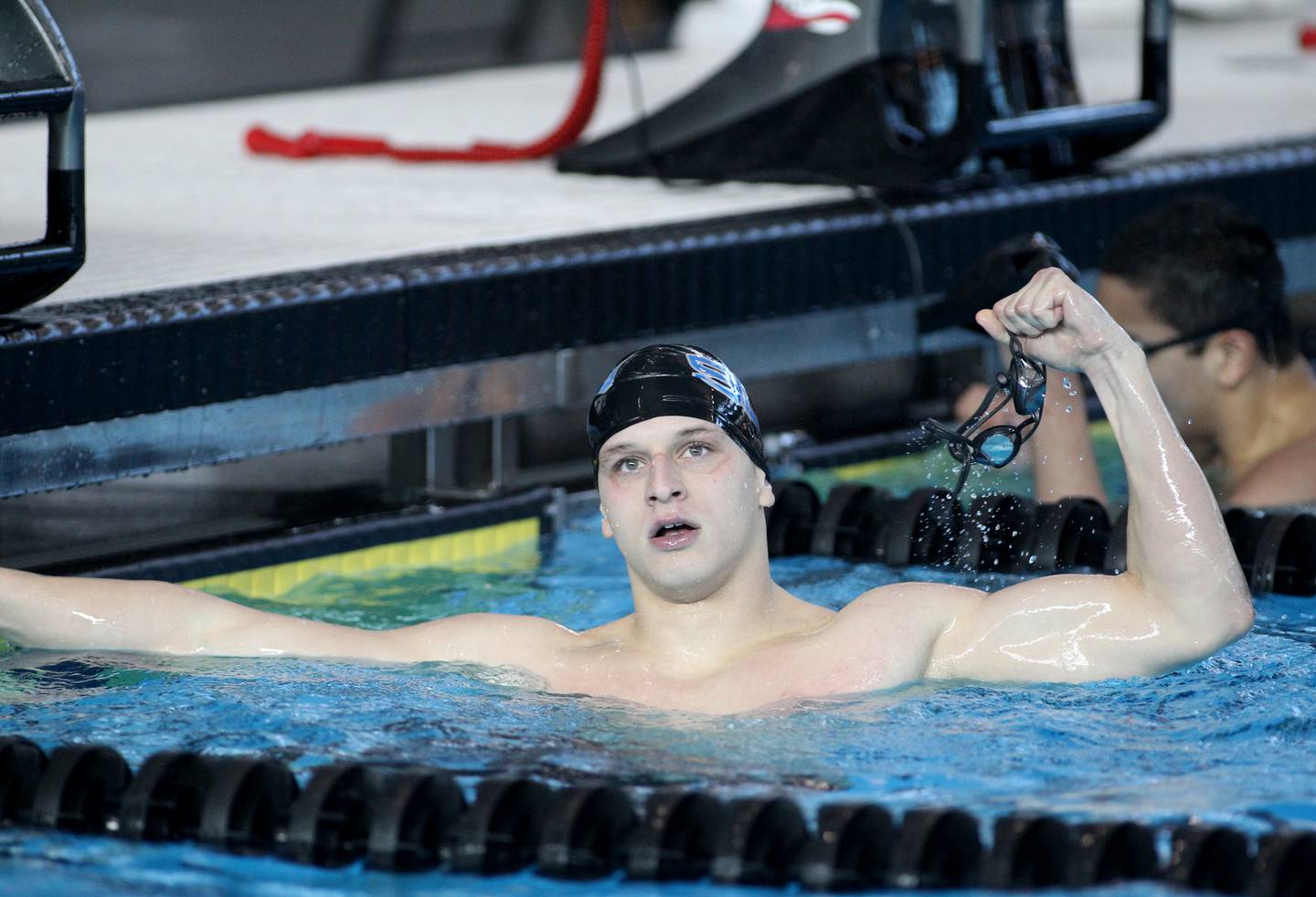 St. Charles North’s Aleksej Filipovic celebrates his win in the championship heat of the 200-yard individual medley during the IHSA Boys Swimming and Diving Championships at FMC Natatorium in Westmont on Saturday, Feb. 26. 2022.