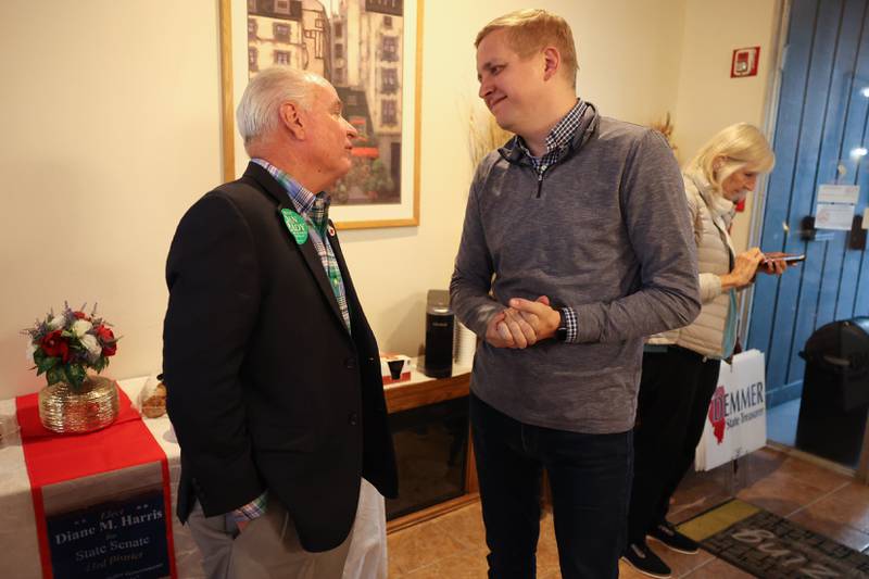 Dan Brady, Republican candidate for Secretary of State, and Tom Demmer, State Representative and candidate for State Treasurer, talk at the GOP event at Its Amazing in Joliet on Monday.