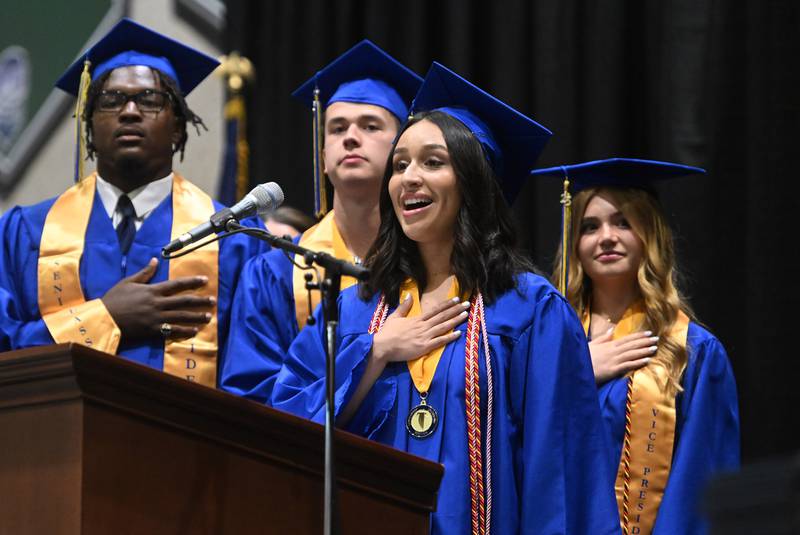 Wheaton North High School graduate Natalie Elizabeth Diaz sings the National Anthem during the school's graduation ceremony on Saturday, May 24, 2025 at College of DuPage in Glen Ellyn.